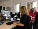 ARRL VEC Manager Maria Somma, AB1FM (left), and ARRL VEC Assistant Manager Perry Green, WY1O, proctor an exam session in Antarctica via Skype.